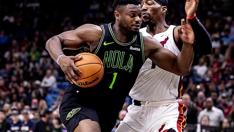 Feb 23, 2024; New Orleans, Louisiana, USA; New Orleans Pelicans forward Zion Williamson (1) drives to the basket against Miami Heat center Bam Adebayo (13) during the second half at Smoothie King Center. Mandatory Credit: Stephen Lew-USA TODAY Sports