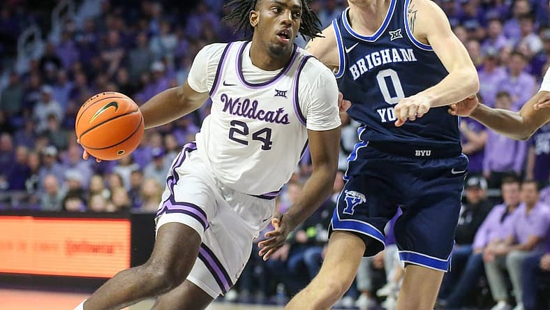 Feb 24, 2024; Manhattan, Kansas, USA; Kansas State Wildcats forward Arthur Kaluma (24) drives to the basket against Brigham Young Cougars forward Noah Waterman (0) duering the first half at Bramlage Coliseum. Mandatory Credit: Scott Sewell-USA TODAY Sports