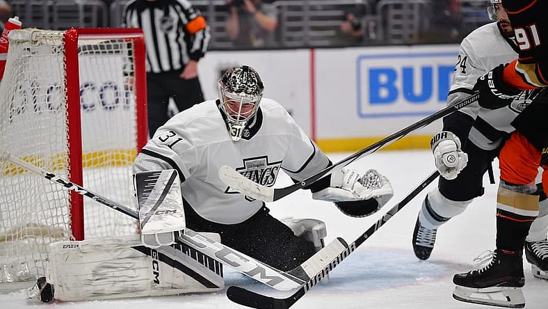 Feb 24, 2024; Los Angeles, California, USA; Los Angeles Kings goaltender David Rittich (31) defends the goal against Anaheim Ducks center Leo Carlsson (91) during the first period at Crypto.com Arena. Mandatory Credit: Gary A. Vasquez-USA TODAY Sports