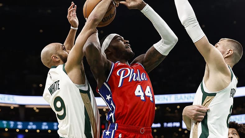 Feb 27, 2024; Boston, Massachusetts, USA; Boston Celtics guard Derrick White (9) knocks the ball away from Philadelphia 76ers forward Paul Reed (44) as he goes for a shot during the first quarter at TD Garden. Mandatory Credit: Winslow Townson-USA TODAY Sports
