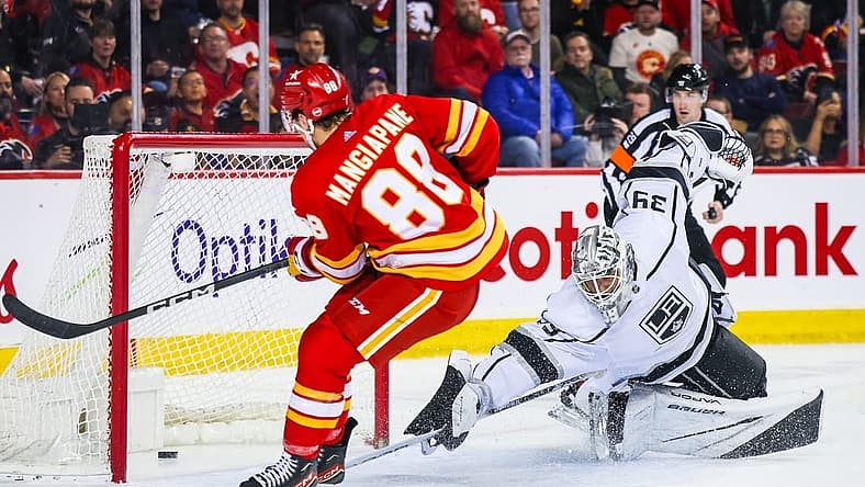 Feb 27, 2024; Calgary, Alberta, CAN; Calgary Flames left wing Andrew Mangiapane (88) scores a goal against Los Angeles Kings goaltender Cam Talbot (39) during the second period at Scotiabank Saddledome. Mandatory Credit: Sergei Belski-USA TODAY Sports