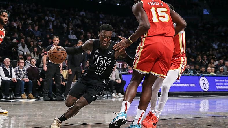 Feb 29, 2024; Brooklyn, New York, USA; Brooklyn Nets guard Dennis Schroder (17) moves the ball against Atlanta Hawks center Clint Capela (15) in the first quarter at Barclays Center. Mandatory Credit: Wendell Cruz-USA TODAY Sports