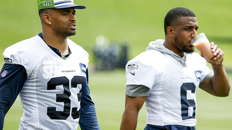 Jun 7, 2022; Renton, Washington, USA; Seattle Seahawks strong safety Jamal Adams (33) and free safety Quandre Diggs (6) walk on the field during minicamp practice at the Virginia Mason Athletic Center Field. Mandatory Credit: Joe Nicholson-USA TODAY Sports