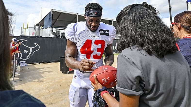 Aug 5, 2022; Houston, Texas, US; Houston Texans linebacker Neville Hewitt (43) signs autographs after training camp at the Texans practice facility. Mandatory Credit: Maria Lysaker-USA TODAY Sports