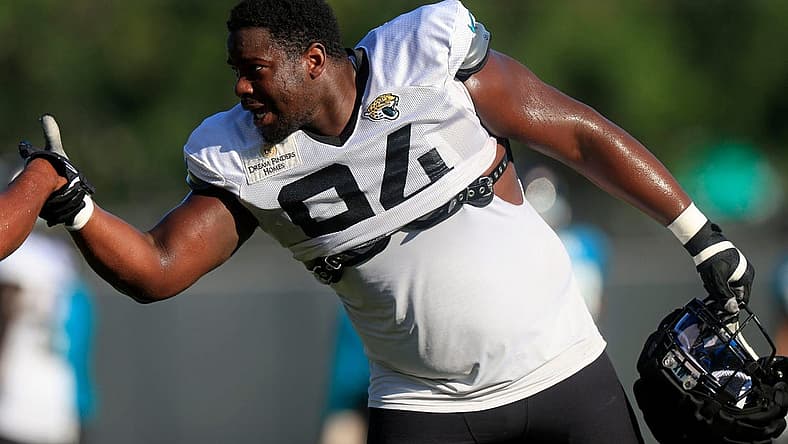 Jacksonville Jaguars defensive tackle Folorunso Fatukasi (94) greets defensive end Dawuane Smoot (91) Dawuane Smoot during training camp Monday, Aug. 7, 2023 at Miller Electric Center at EverBank Stadium in Jacksonville, Fla. This was the 11th day of training camp.