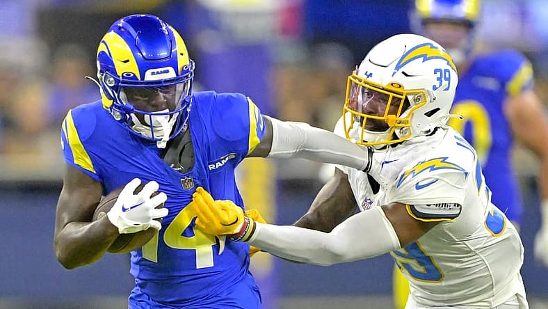 Aug 12, 2023; Inglewood, California, USA;   Los Angeles Rams wide receiver Tyler Johnson (14) is stopped by Los Angeles Chargers cornerback Michael Jacquet (39) after a first down in the second half at SoFi Stadium. Mandatory Credit: Jayne Kamin-Oncea-USA TODAY Sports