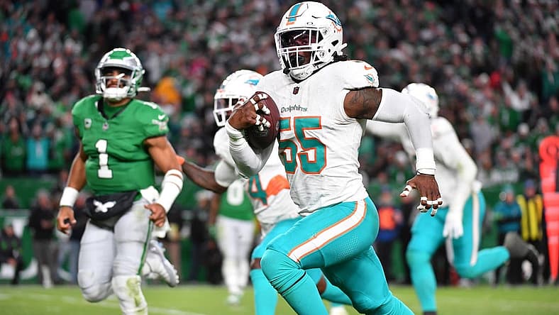 Oct 22, 2023; Philadelphia, Pennsylvania, USA; Miami Dolphins linebacker Jerome Baker (55) returns an interception for a touchdown  during the third quarter against the Philadelphia Eagles at Lincoln Financial Field. Mandatory Credit: Eric Hartline-USA TODAY Sports