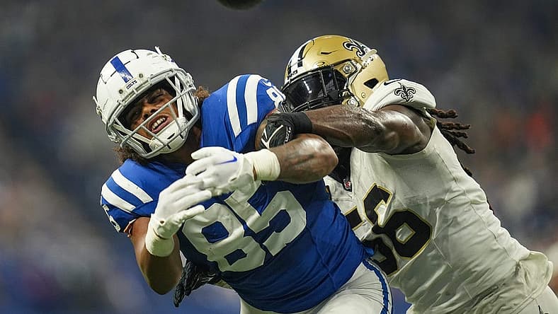 Indianapolis Colts tight end Drew Ogletree (85) is unable to receive thanks to defensive pressure from New Orleans Saints linebacker Demario Davis (56) on Sunday, Oct. 29, 2023, at Lucas Oil Stadium in Indianapolis.