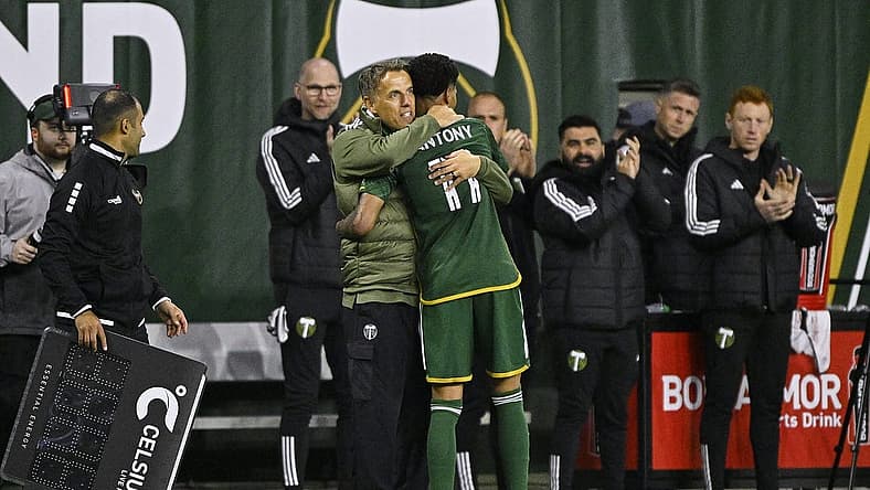 Feb 24, 2024; Portland, Oregon, USA; Portland Timbers head coach Phil Neville hugs forward Antony (11) during the second half against the Colorado Rapids at Providence Park. Mandatory Credit: Troy Wayrynen-USA TODAY Sports