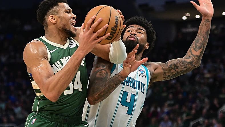 Feb 27, 2024; Milwaukee, Wisconsin, USA; Milwaukee Bucks forward Giannis Antetokounmpo (34) drives for the basket against Charlotte Hornets center Nick Richards (4) in the third quarter at Fiserv Forum. Mandatory Credit: Benny Sieu-USA TODAY Sports