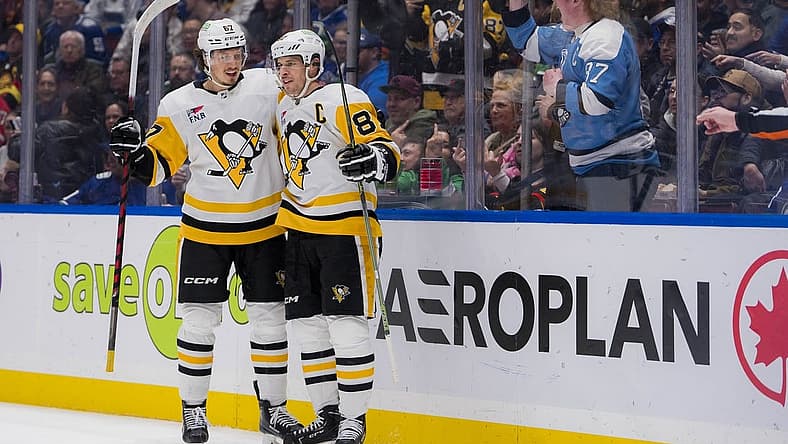 Feb 27, 2024; Vancouver, British Columbia, CAN; Pittsburgh Penguins forward Rickard Rakell (67) and forward Sidney Crosby (87) celebrate Rakell s second goal of the game against the Vancouver Canucks in the second period at Rogers Arena. Mandatory Credit: Bob Frid-USA TODAY Sports