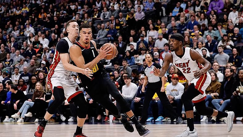 Feb 29, 2024; Denver, Colorado, USA; Denver Nuggets forward Michael Porter Jr. (1) drives to the basket against Miami Heat forward Duncan Robinson (55) in the first quarter at Ball Arena. Mandatory Credit: Isaiah J. Downing-USA TODAY Sports