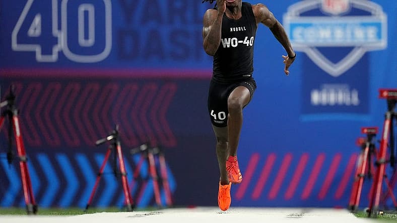 Mar 2, 2024; Indianapolis, IN, USA; Texas wide receiver Xavier Worthy (WO40) ran an official time of 4.21 seconds to set a combine record during the 2024 NFL Combine at Lucas Oil Stadium. Mandatory Credit: Kirby Lee-USA TODAY Sports