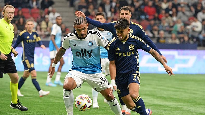 Mar 2, 2024; Vancouver, British Columbia, CAN; Charlotte FC defender Jere Uronen (3) and Vancouver Whitecaps FC midfielder Ryan Raposo (7) race after the ball during the first half at BC Place. Mandatory Credit: Anne-Marie Sorvin-USA TODAY Sports