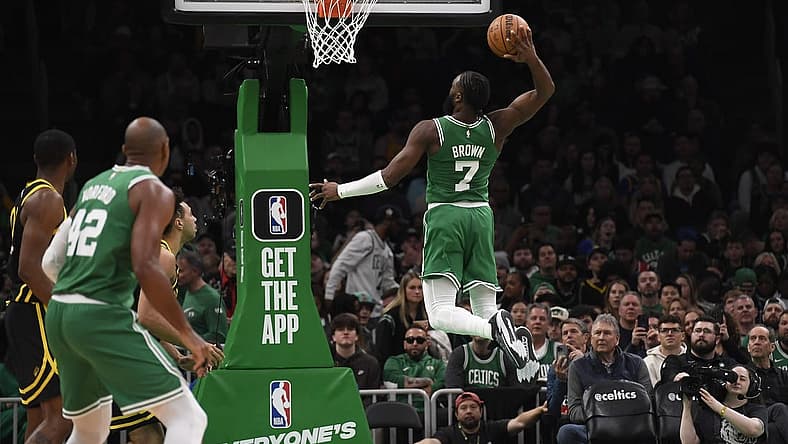 Mar 3, 2024; Boston, Massachusetts, USA; Boston Celtics guard Jaylen Brown (7) goes in for a dunk during the second half against the Golden State Warriors at TD Garden. Mandatory Credit: Bob DeChiara-USA TODAY Sports