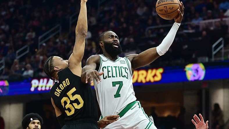 Mar 5, 2024; Cleveland, Ohio, USA; Boston Celtics guard Jaylen Brown (7) drives to the basket against Cleveland Cavaliers forward Isaac Okoro (35) during the first half at Rocket Mortgage FieldHouse. Mandatory Credit: Ken Blaze-USA TODAY Sports
