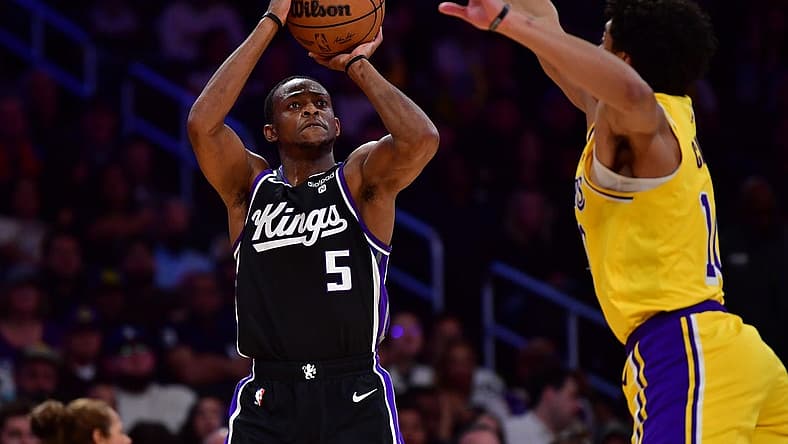 Mar 6, 2024; Los Angeles, California, USA; Sacramento Kings guard De'Aaron Fox (5) shoots against Los Angeles Lakers guard Max Christie (10) during the first half at Crypto.com Arena. Mandatory Credit: Gary A. Vasquez-USA TODAY Sports