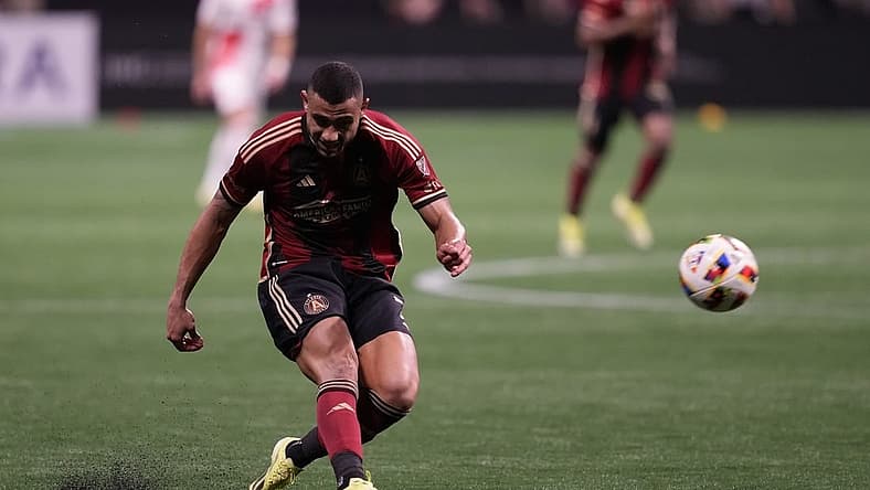Mar 9, 2024; Atlanta, Georgia, USA; Atlanta United forward Giorgos Giakoumakis (7) shoots the ball against the New England Revolution during the second half at Mercedes-Benz Stadium. Mandatory Credit: Dale Zanine-USA TODAY Sports