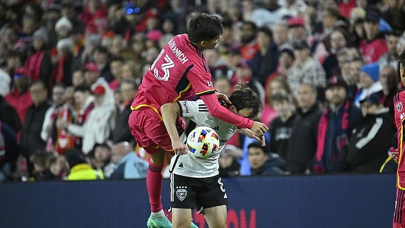 Mar 23, 2024; St. Louis, Missouri, USA; St. Louis CITY SC defender Anthony Markanich (13) challenges D.C. United midfielder Jared Stroud (8) for the ball during the second half at CITYPARK. Mandatory Credit: Scott Rovak-USA TODAY Sports