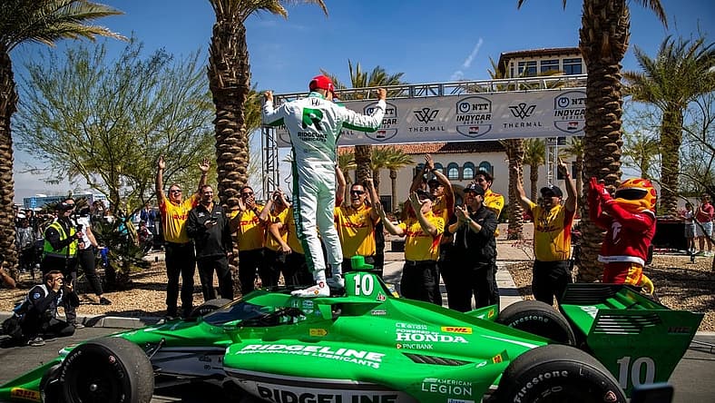Alex Palou of Chip Ganassi Racing celebrates winning the feature race of the $1 Million Challenge with his team at The Thermal Club in Thermal, Calif., Sunday, March 24, 2024.