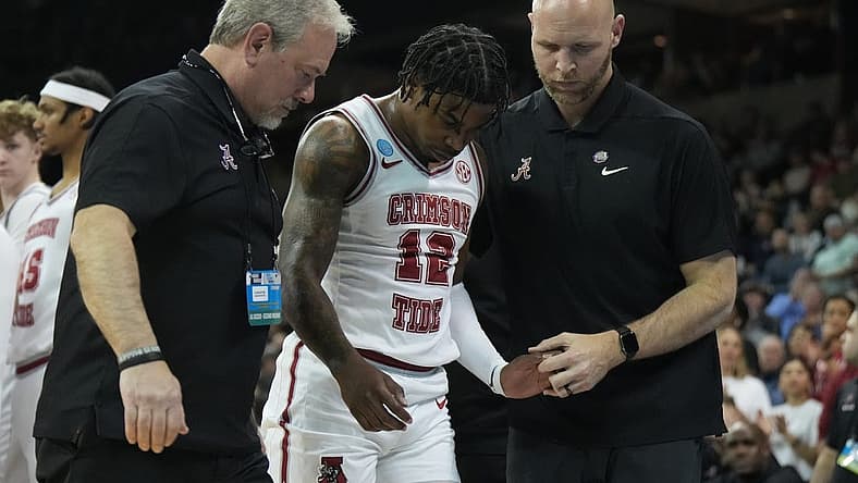 Mar 24, 2024; Spokane, WA, USA; Alabama Crimson Tide guard Latrell Wrightsell Jr. (12) is attended to by official in the first half against the Grand Canyon Antelopes at Spokane Veterans Memorial Arena. Mandatory Credit: Kirby Lee-USA TODAY Sports