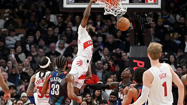 Mar 25, 2024; Toronto, Ontario, CAN; Toronto Raptors guard Javon Freeman-Liberty (0) dunks against the Brooklyn Nets in the first half at Scotiabank Arena. Mandatory Credit: Dan Hamilton-USA TODAY Sports