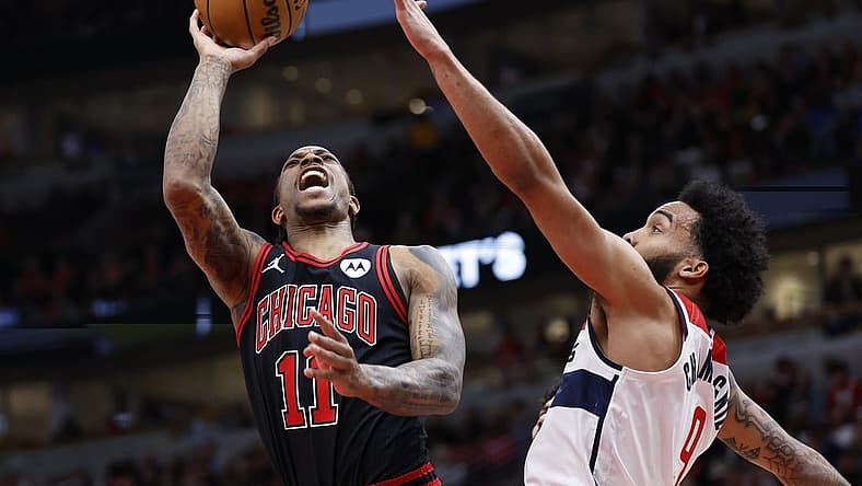 Mar 25, 2024; Chicago, Illinois, USA; Chicago Bulls forward DeMar DeRozan (11) goes to the basket against Washington Wizards forward Justin Champagnie (99) during the first half at United Center. Mandatory Credit: Kamil Krzaczynski-USA TODAY Sports