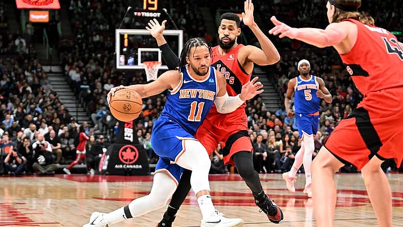 Mar 27, 2024; Toronto, Ontario, CAN; New York Knicks guard Jalen Brunson (11) dribbles the ball against Toronto Raptors guard Garrett Temple (17) in the first half at Scotiabank Arena. Mandatory Credit: Dan Hamilton-USA TODAY Sports