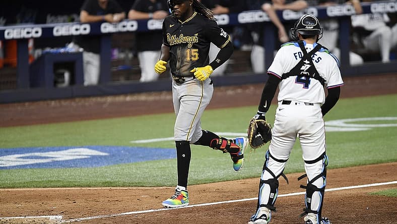 Mar 28, 2024; Miami, Florida, USA; Pittsburgh Pirates shortstop Oneil Cruz (15) trots to home plate in front of Miami Marlins catcher Nick Fortes (4) during the eighth inning, at loanDepot Park. Mandatory Credit: Michael Laughlin-USA TODAY Sports