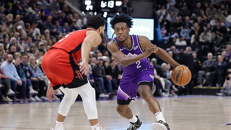 Mar 29, 2024; Salt Lake City, Utah, USA; Utah Jazz guard Collin Sexton (2) tries to dribble past Houston Rockets guard Fred VanVleet (5) during the second quarter at Delta Center. Mandatory Credit: Chris Nicoll-USA TODAY Sports