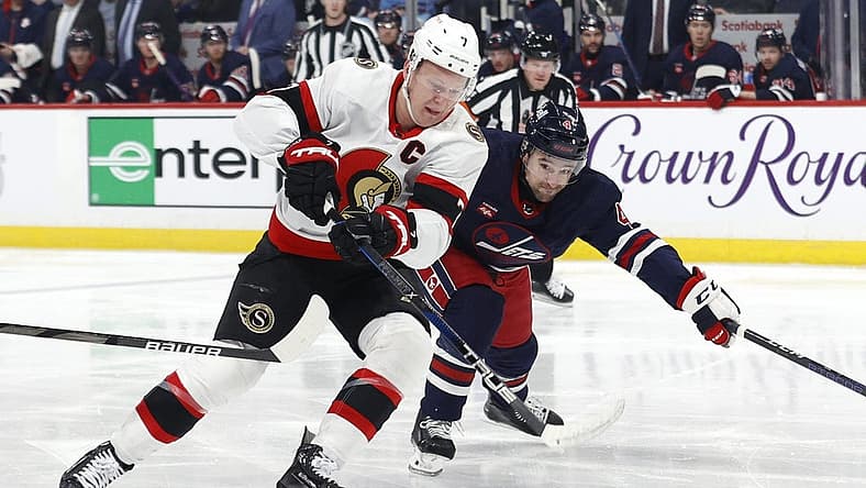 Mar 30, 2024; Winnipeg, Manitoba, CAN; Ottawa Senators left wing Brady Tkachuk (7) is chased down by Winnipeg Jets defenseman Neal Pionk (4) in the first period at Canada Life Centre. Mandatory Credit: James Carey Lauder-USA TODAY Sports