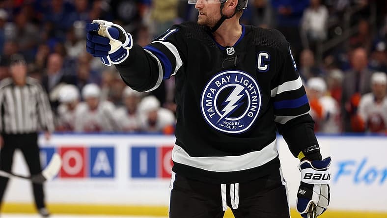 Mar 30, 2024; Tampa, Florida, USA; Tampa Bay Lightning center Steven Stamkos (91) points against the New York Islanders during the first period at Amalie Arena. Mandatory Credit: Kim Klement Neitzel-USA TODAY Sports
