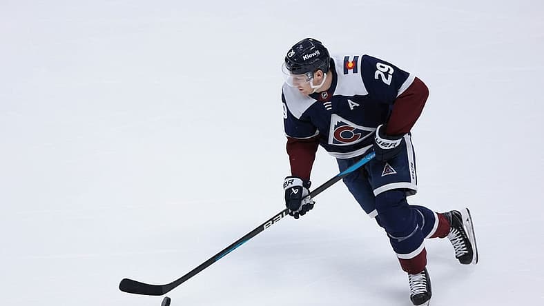 Mar 30, 2024; Denver, Colorado, USA; Colorado Avalanche center Nathan MacKinnon (29) skates with the puck during the third period against the Nashville Predators at Ball Arena. Mandatory Credit: Andrew Wevers-USA TODAY Sports