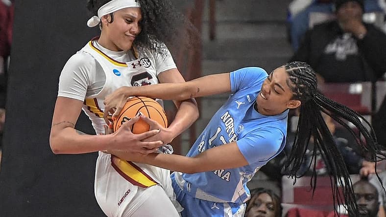 Mar 24, 2034; Columbia, So Carolina, USA; South Carolina center Kamilla Cardoso (10) and University of North Carolina guard Teonni Key (13) try to get a rebound during the second quarter of the second round NCAA Women's Basketball Tournament game at the Colonial Life Center. Mandatory Credit: Ken Ruinard-USA TODAY Sports via Greenville News