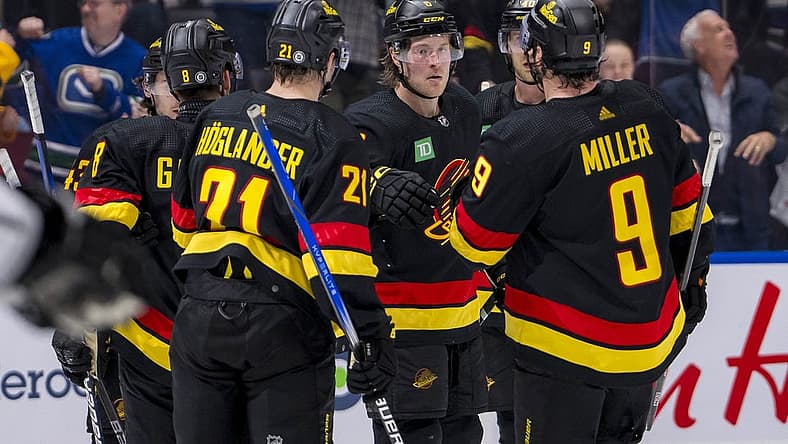 Mar 25, 2024; Vancouver, British Columbia, CAN; Vancouver Canucks defenseman Quinn Hughes (43), forward Nils Hoglander (21), forward Brock Boeser (6), forward J.T. Miller (9) and forward Elias Pettersson (40) celebrate Boeser’s goal against the Los Angeles Kings in the third period at Rogers Arena. Kings won 3 -2. Mandatory Credit: Bob Frid-USA TODAY Sports