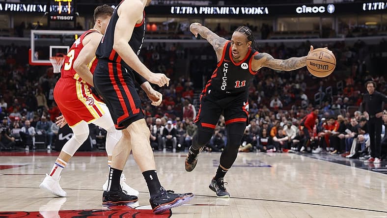 Apr 1, 2024; Chicago, Illinois, USA; Chicago Bulls forward DeMar DeRozan (11) tries to control the ball against the Atlanta Hawks during the first half at United Center. Mandatory Credit: Kamil Krzaczynski-USA TODAY Sports