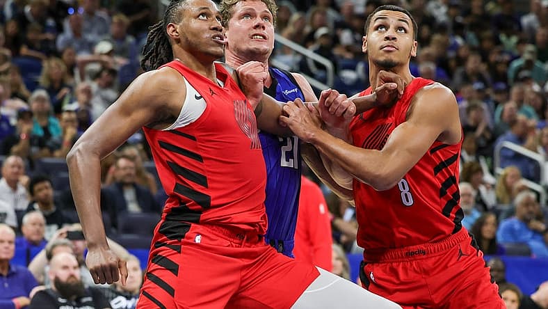 Apr 1, 2024; Orlando, Florida, USA; Portland Trail Blazers forward Jabari Walker (34) forward Kris Murray (8) and Orlando Magic center Moritz Wagner (21) look for the rebound during the second half at Amway Center. Mandatory Credit: Mike Watters-USA TODAY Sports