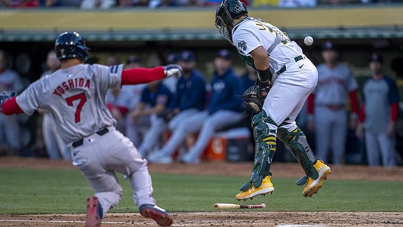 Apr 1, 2024; Oakland, California, USA; Boston Red Sox left fielder Masataka Yoshida (7) scores on the throw to Oakland Athletics catcher Shea Langeliers (23) during the second inning at Oakland-Alameda County Coliseum. Mandatory Credit: Neville E. Guard-USA TODAY Sports
