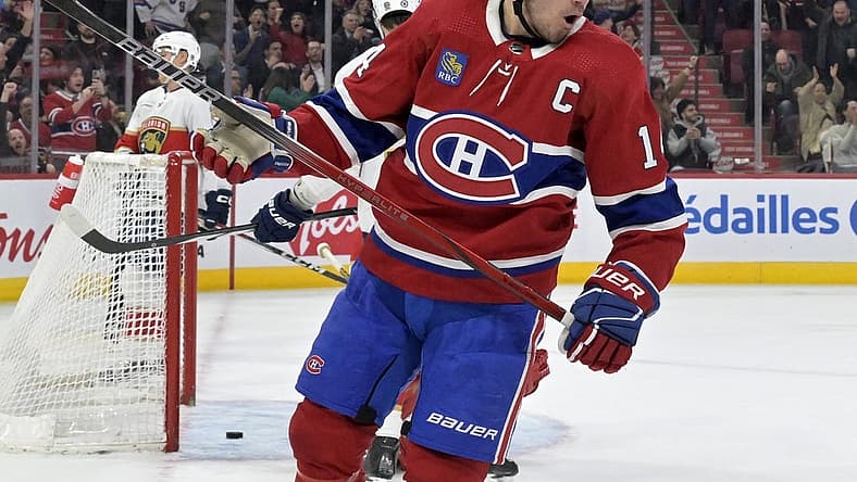Apr 2, 2024; Montreal, Quebec, CAN; Montreal Canadiens forward Nick Suzuki (14) celebrates after scoring a goal against the Florida Panthers during the second period at the Bell Centre. Mandatory Credit: Eric Bolte-USA TODAY Sports