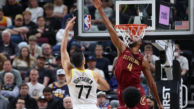 Apr 2, 2024; Salt Lake City, Utah, USA; Cleveland Cavaliers forward Evan Mobley (4) blocks the shot of Utah Jazz center Omer Yurtseven (77) during the second quarter at Delta Center. Mandatory Credit: Rob Gray-USA TODAY Sports