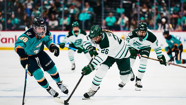Boston Fleet forward Ella Huber breaks ahead with the puck as Sirens rookie Kristyna Kaltounkova defends.