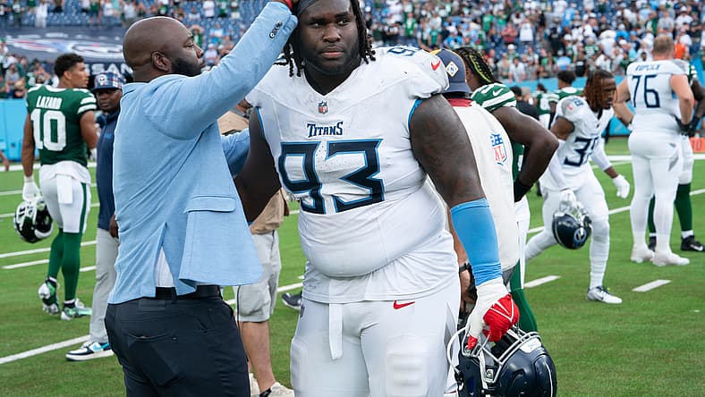 Tennessee Titans General Manager Ran Carthon greets Tennessee Titans defensive tackle T'Vondre Sweat (93) after their 24-17 loss