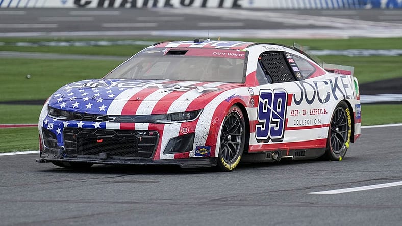 May 29, 2023; Concord, North Carolina, USA; NASCAR Cup Series driver Daniel Suarez (99) on pit road during the Coca-Cola 600 at Charlotte Motor Speedway. Mandatory Credit: Jim Dedmon-USA TODAY Sports