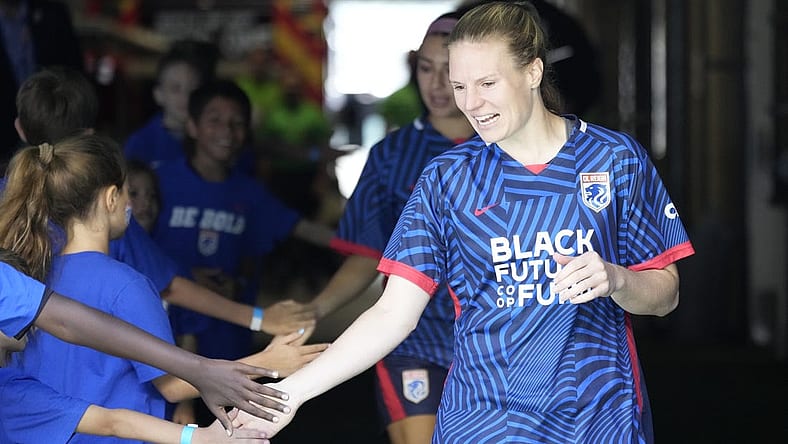 Jul 1, 2023; Seattle, Washington, USA;  OL Reign forward Veronica Latsko (24) greets fans as she walks to the field before playing against Racing Louisville FC in a NWSL game at Lumen Field. Mandatory Credit: Stephen Brashear-USA TODAY Sports