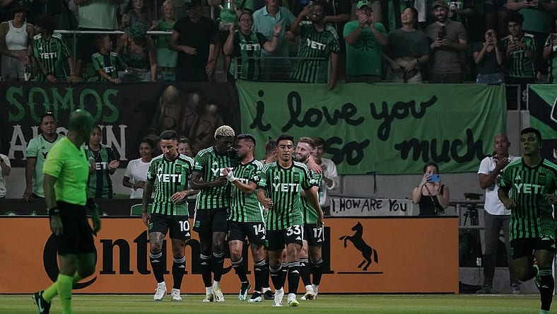 Jul 15, 2023; Austin, Texas, USA; Austin FC midfielder Ethan Finlay (13) celebrates with teammates after scoring a goal against the Sporting Kansas City during the first half at Q2 Stadium. Mandatory Credit: Scott Wachter-USA TODAY Sports