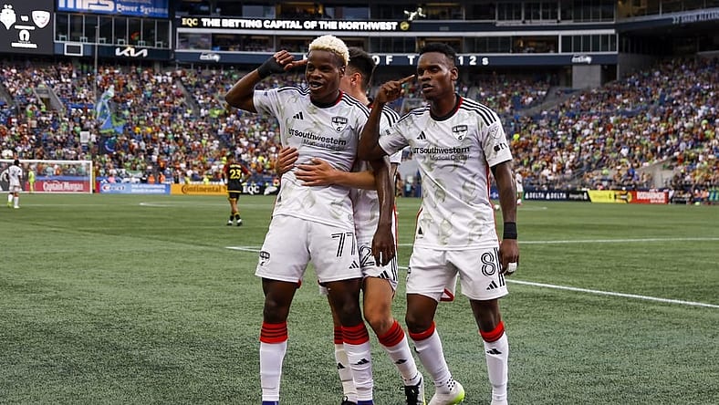 Jul 15, 2023; Seattle, Washington, USA; FC Dallas forward Bernard Kamungo (77) celebrates with forward Jader Obrian (8) after scoring a goal against the Seattle Sounders FC during the first half at Lumen Field. Mandatory Credit: Joe Nicholson-USA TODAY Sports