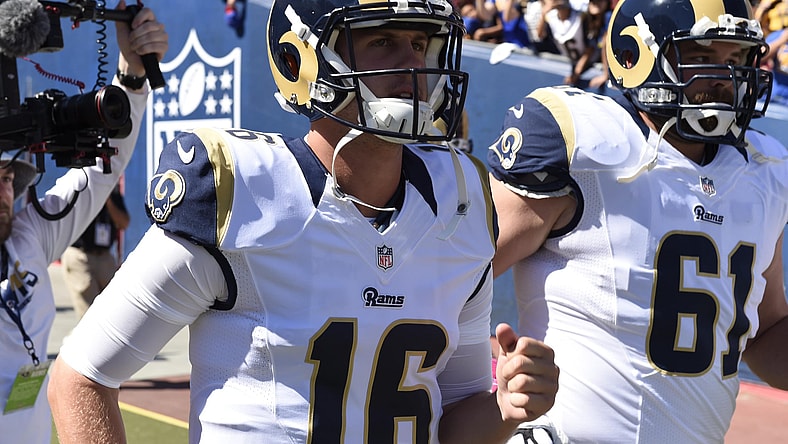 Rams quarterback Jared Goff leads the team on the field