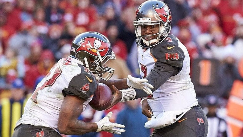Jameis Winston hands off to Doug Martin