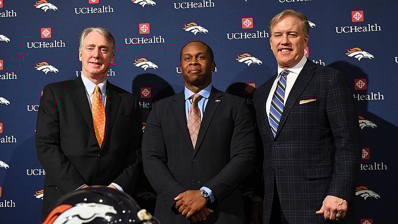 Tony Romo hasn't been discussed by Vance Joseph, John Elway and Co.?