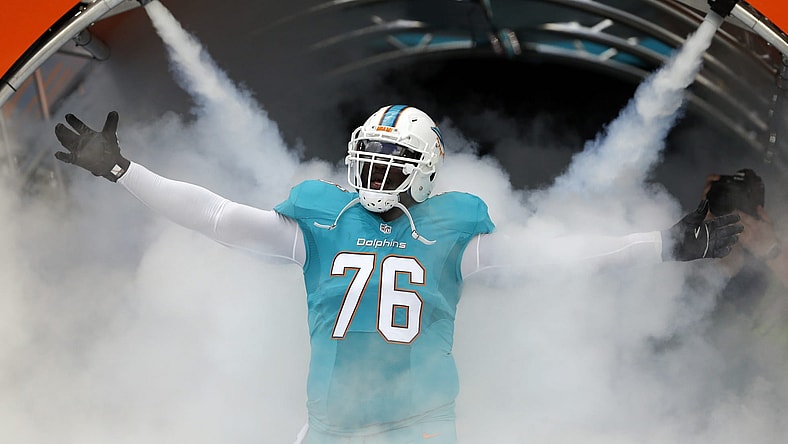 Jan 1, 2017; Miami Gardens, FL, USA; Miami Dolphins offensive tackle Branden Albert (76) is introduced before an NFL football game against the New England Patriots at Hard Rock Stadium. Mandatory Credit: Reinhold Matay-USA TODAY Sports